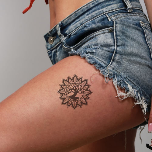 Tatouage arbre de vie sacré et mandala pour femme sur la cuisse