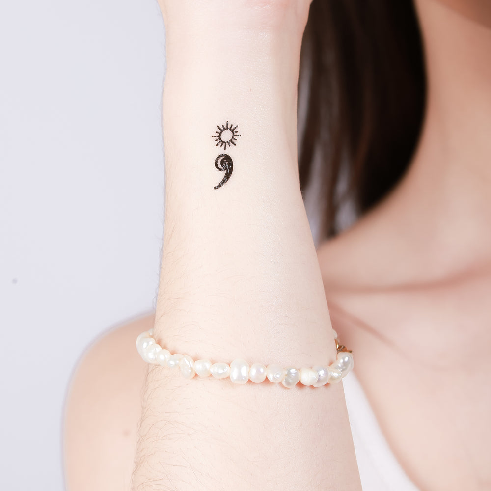 Comma dot tattoo